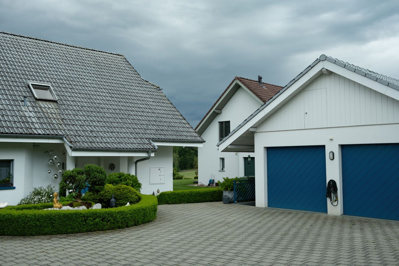 Clean block-paved driveway outside a house