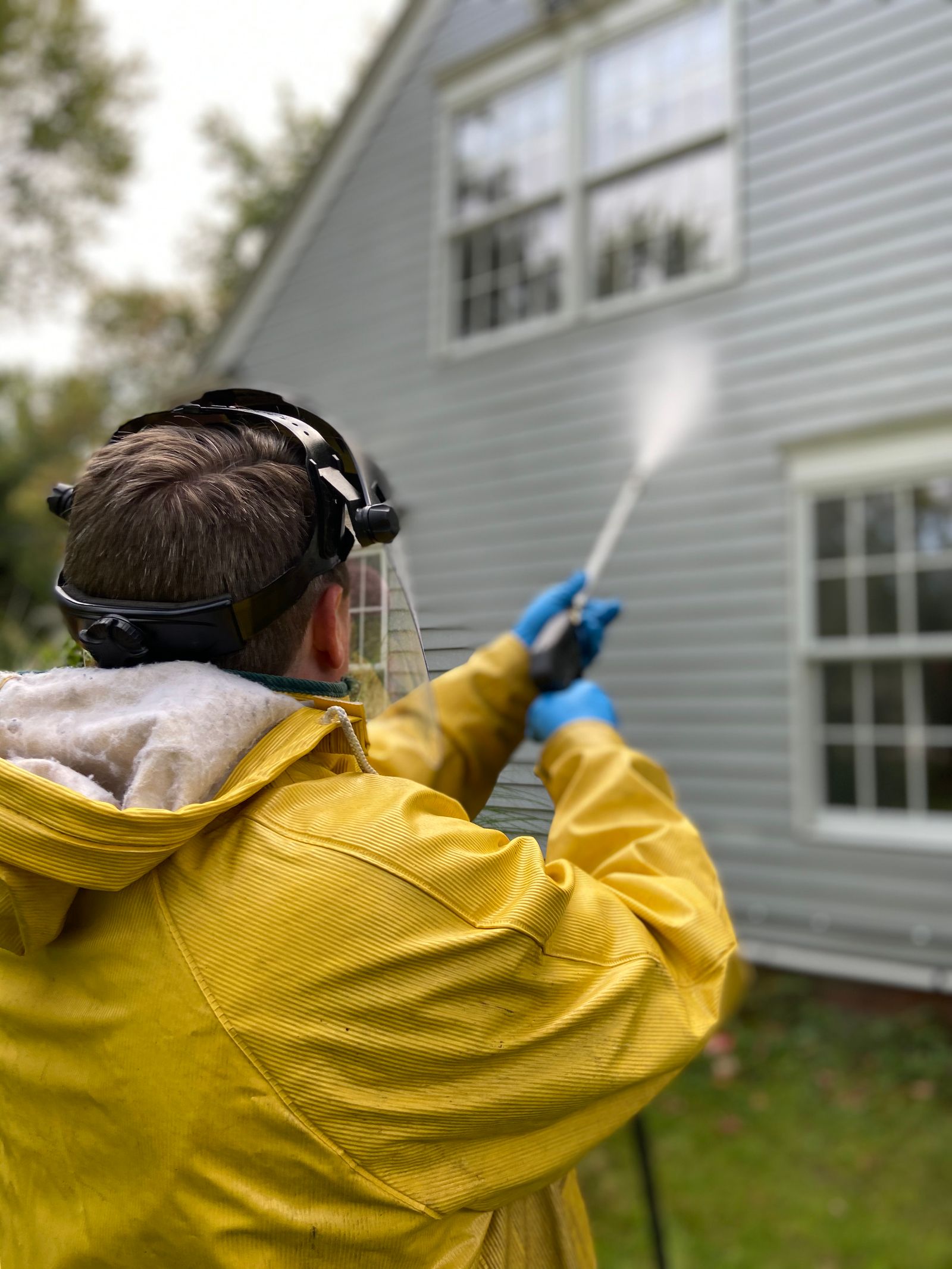 Jet washing exterior wall render